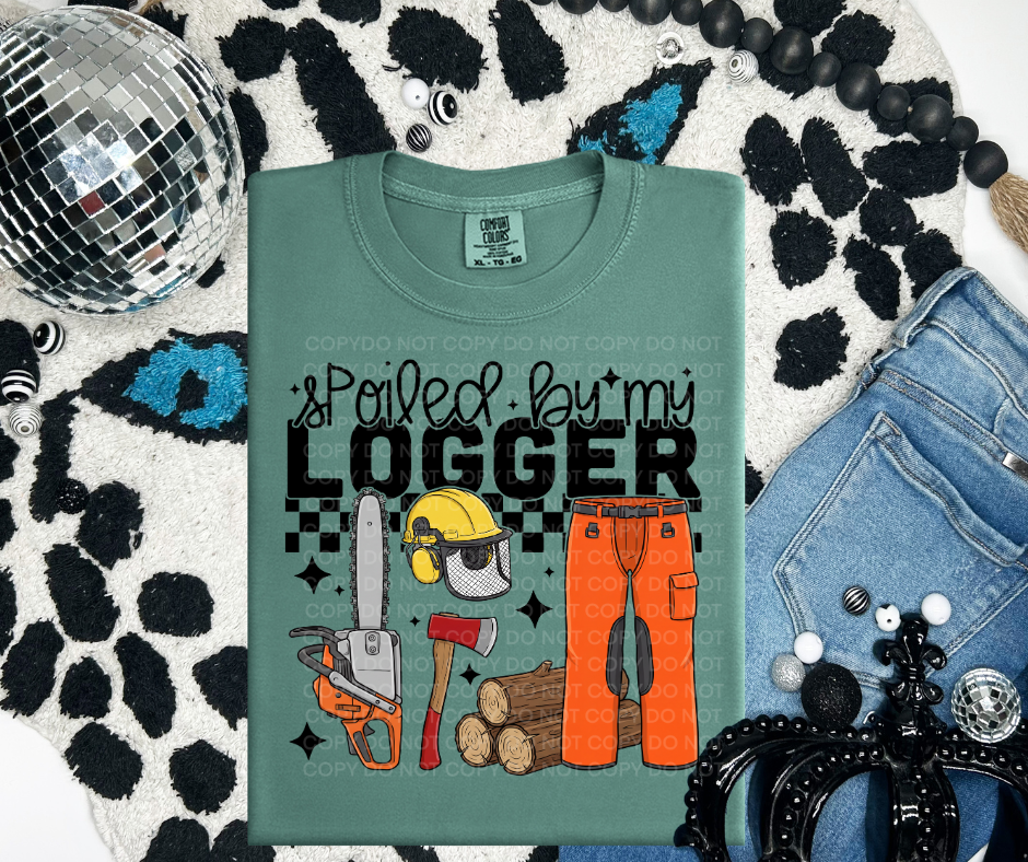 Spoiled by my logger graphic tee on Comfort Colors shirt, southern blue collar wife shirt in moss green flat lay