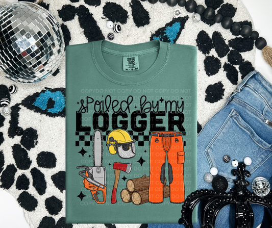 Spoiled by my logger graphic tee on Comfort Colors shirt, southern blue collar wife shirt in moss green flat lay
