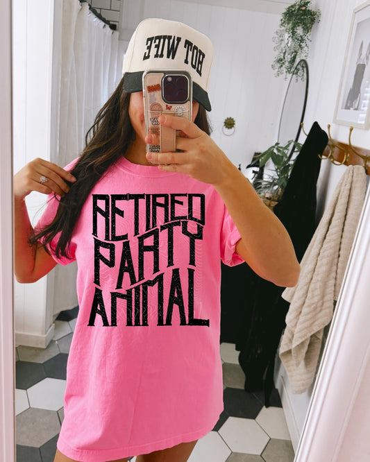 Retired Party Animal graphic tee on neon pink Comfort Colors shirt