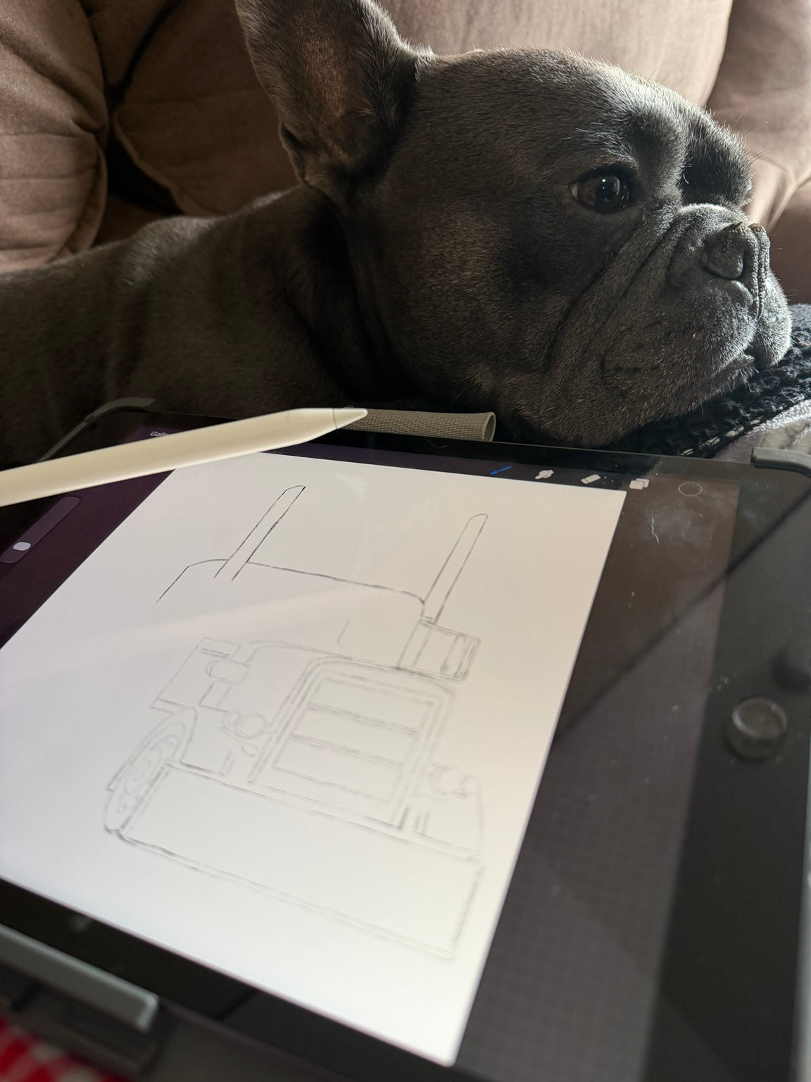 Chapo supervising apparel design on iPad